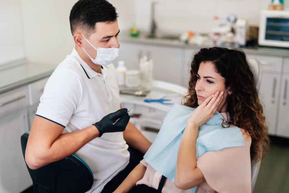 dentist treating a cracked tooth to relieve pain and prevent further damage