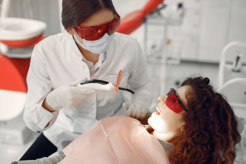 professional teeth whitening treatment helping remove stains and brighten a patient smile